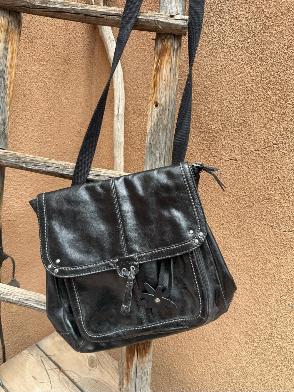 The Sak Black Leather Crossbody Shoulder Bag with Flower Detail